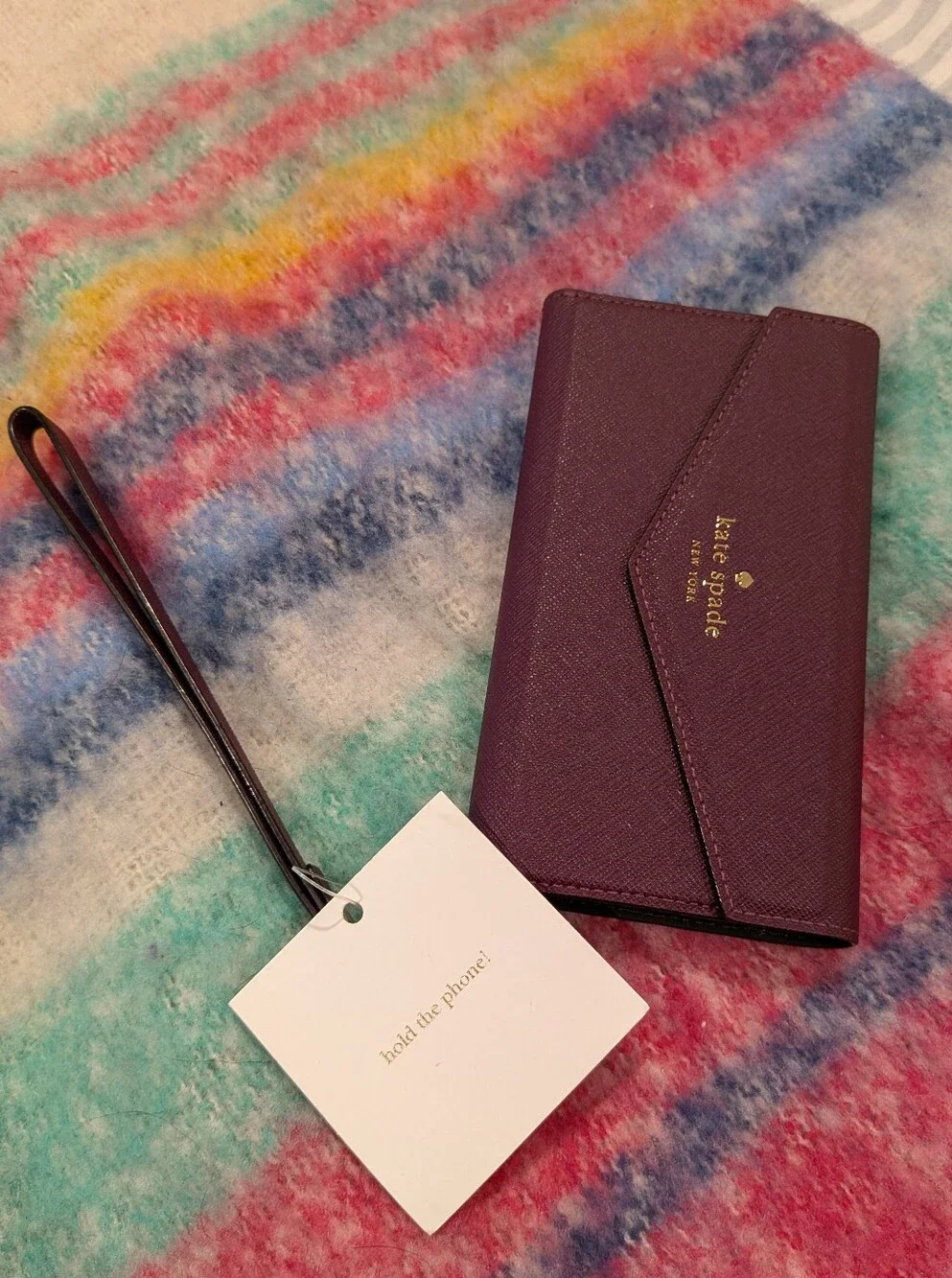 kate spade Plum Leather Wristlet Phone Case with Gold Logo